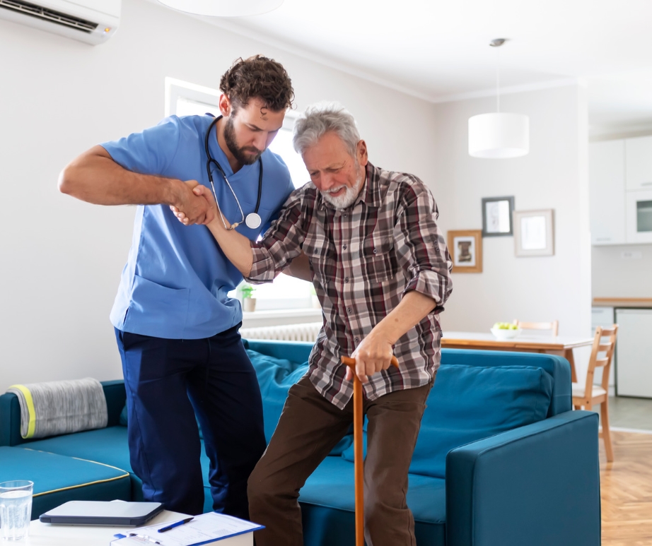 Male caregiver helping a senior